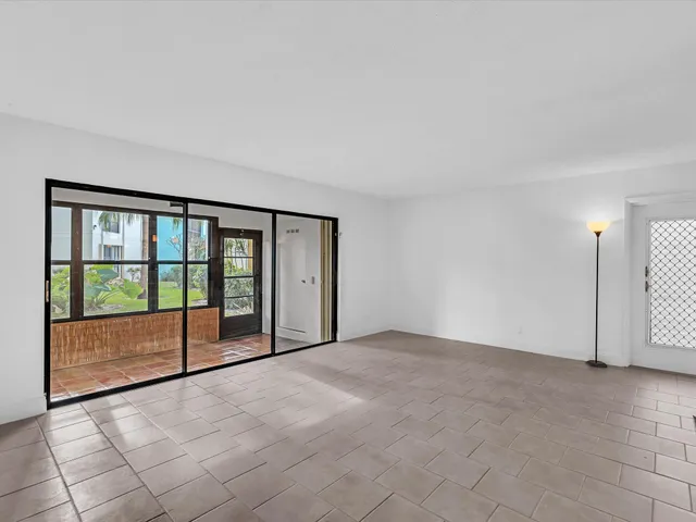 a view of an empty room with a balcony
