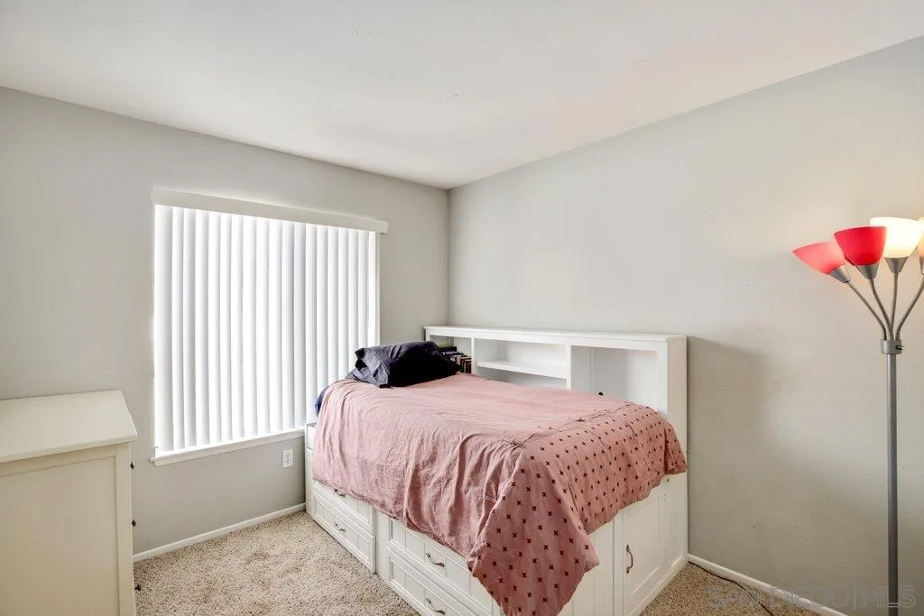 2807 Via Pajaro Carlsbad, CA 92010 - Photo 18 of 26 a bedroom with a bed and a window