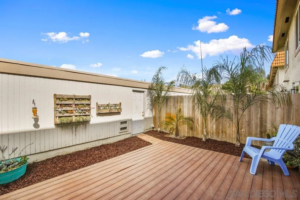 2807 Via Pajaro Carlsbad, CA 92010 - Photo 2 of 26 a view of a living room and kitchen with furniture and a floor to ceiling window