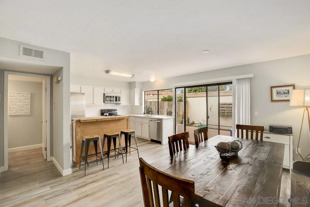 2807 Via Pajaro Carlsbad, CA 92010 - Photo 4 of 26 a view of a dining room with furniture window and wooden floor