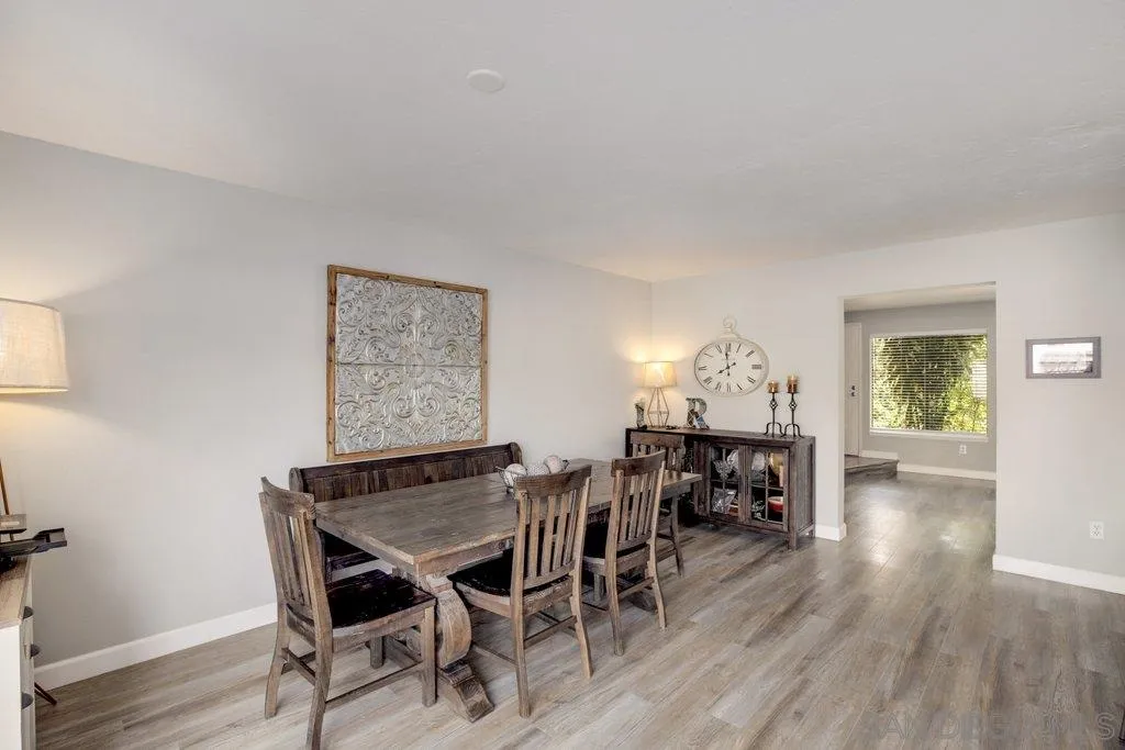 2807 Via Pajaro Carlsbad, CA 92010 - Photo 8 of 26 a view of a dining room with furniture and wooden floor