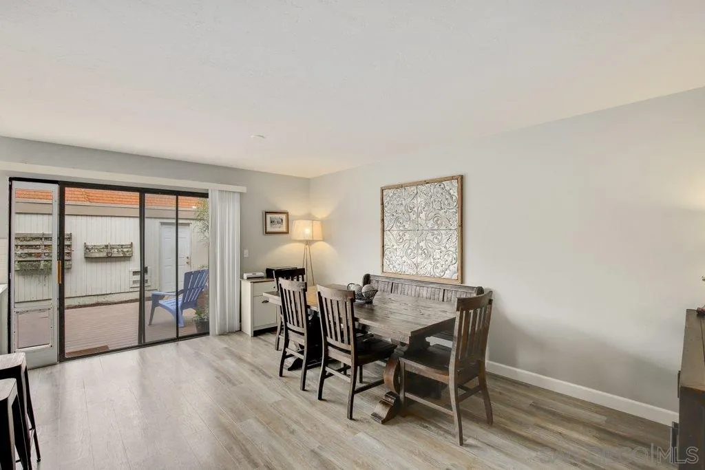 2807 Via Pajaro Carlsbad, CA 92010 - Photo 9 of 26 a view of a dining room with furniture window and wooden floor