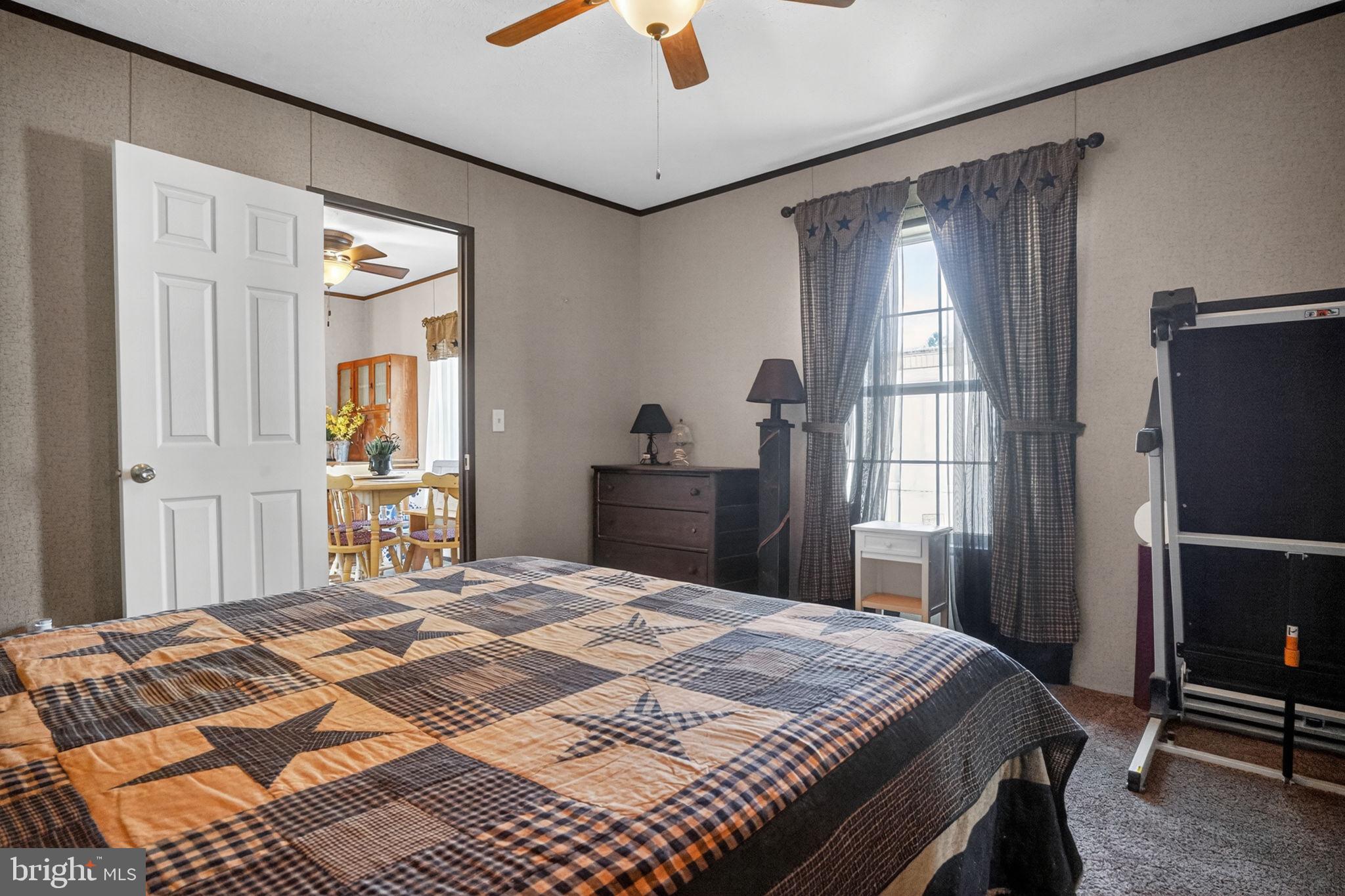 39 Country Club Road West Northampton, PA 18067 - Photo 10 of 26 a bedroom with a bed and a chandelier