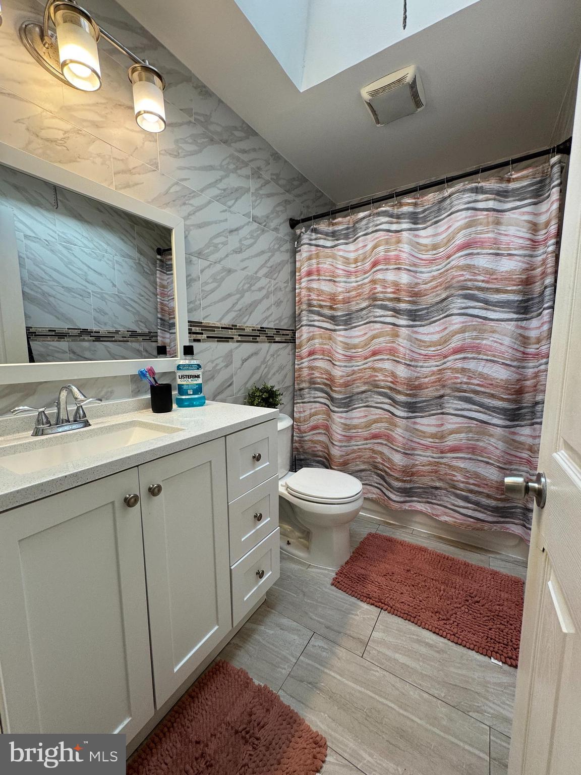 1234 Greeby Street Philadelphia, PA 19111 - Photo 13 of 18 a bathroom with a sink mirror vanity and toilet