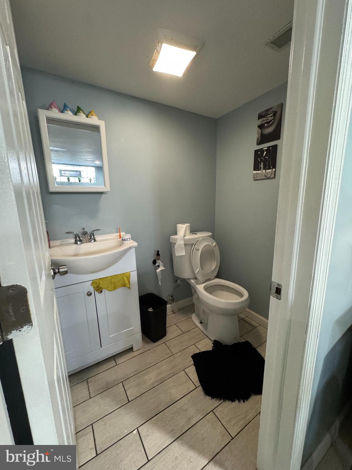 1234 Greeby Street Philadelphia, PA 19111 - Photo 15 of 18 a bathroom with a toilet sink and mirror