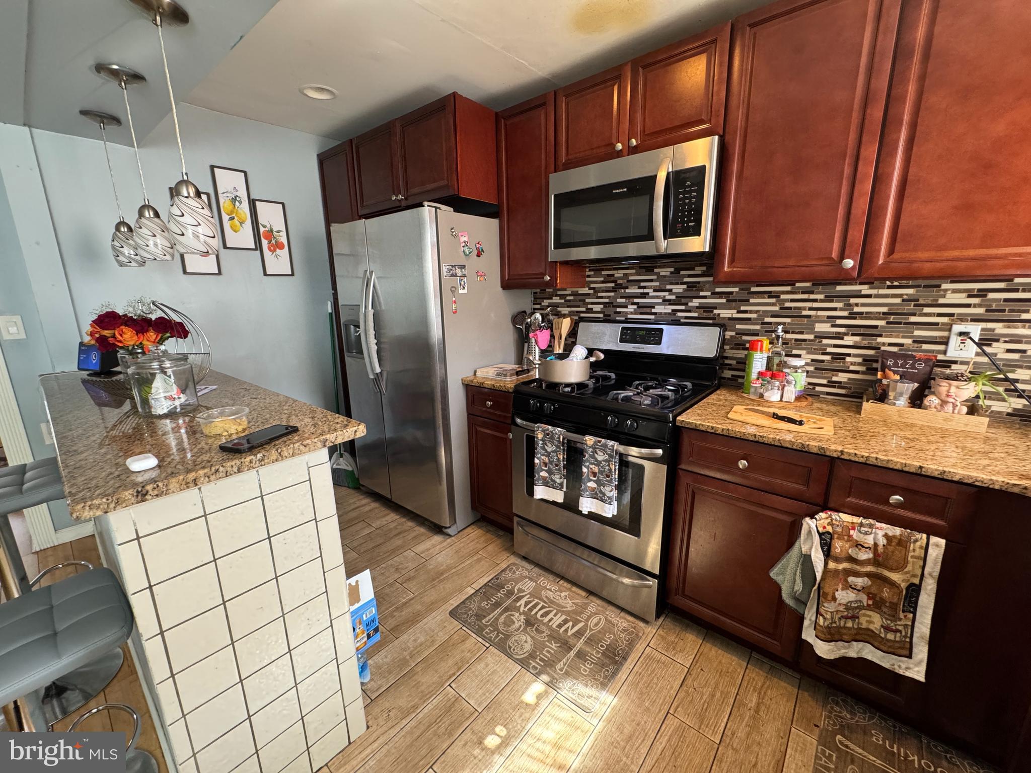 1234 Greeby Street Philadelphia, PA 19111 - Photo 7 of 18 a kitchen with stainless steel appliances granite countertop a refrigerator stove and sink