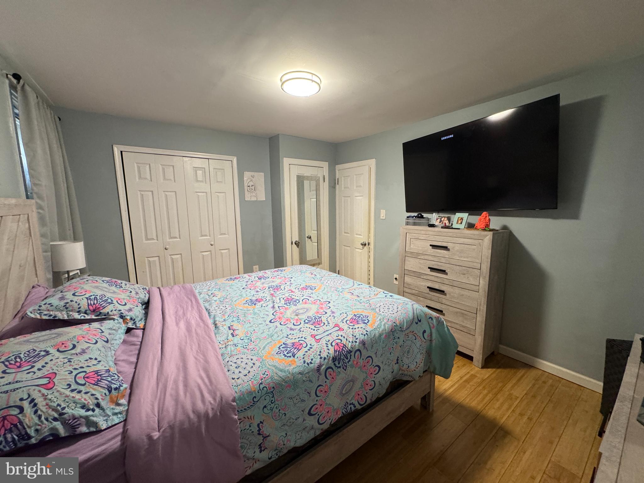 1234 Greeby Street Philadelphia, PA 19111 - Photo 10 of 18 a bedroom with a bed and a flat screen tv