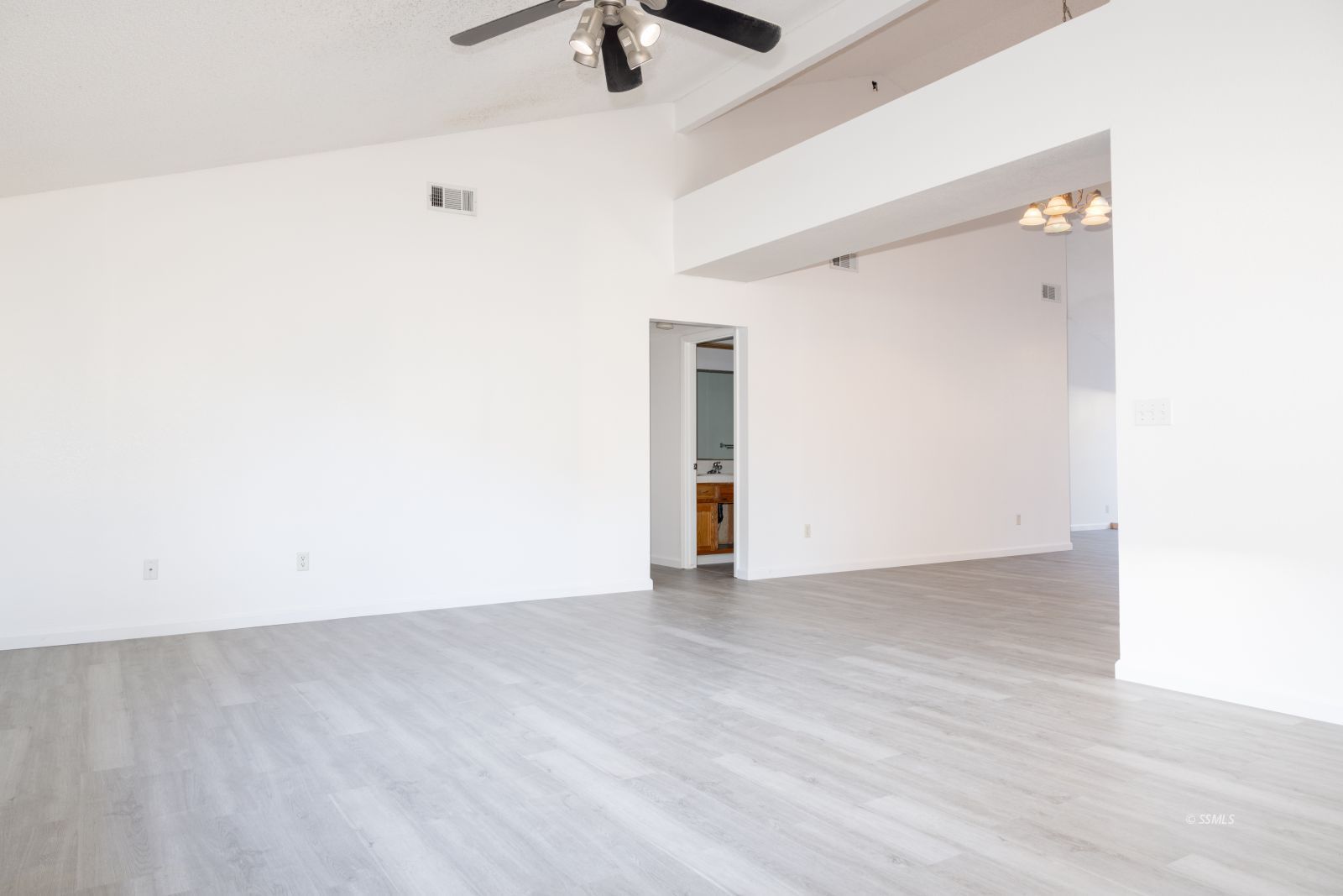 820 Walker Lane Ridgecrest, CA 93555 - Photo 6 of 27 an empty room with ceiling fan and window