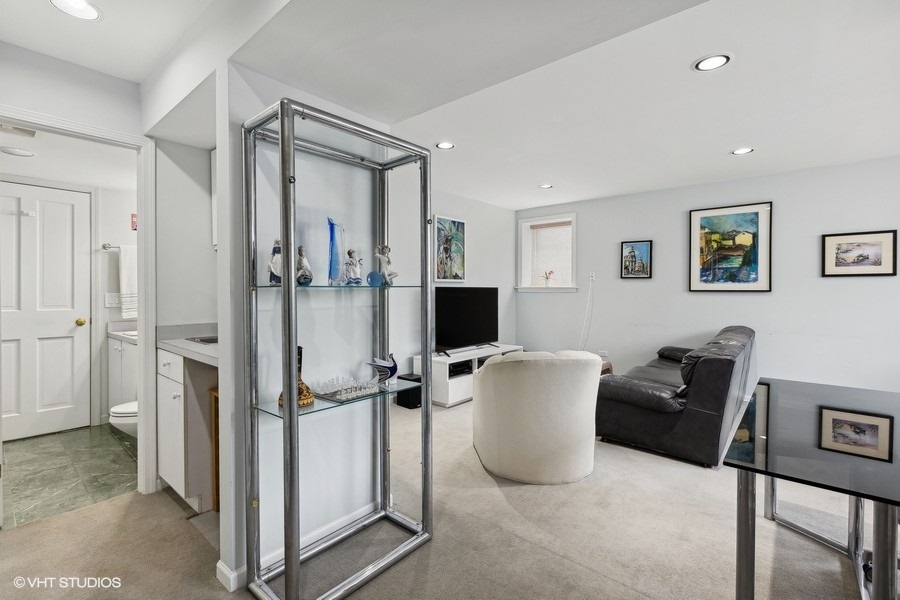 Undisclosed Address Chicago, IL 60657 - Photo 13 of 40 a living room with furniture and a table