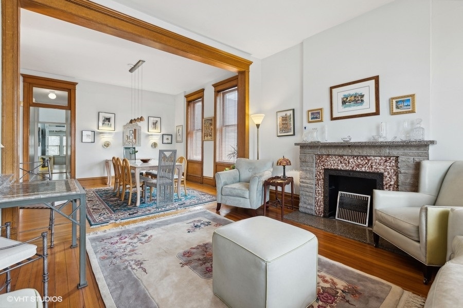 Undisclosed Address Chicago, IL 60657 - Photo 3 of 40 a living room with furniture and a fireplace