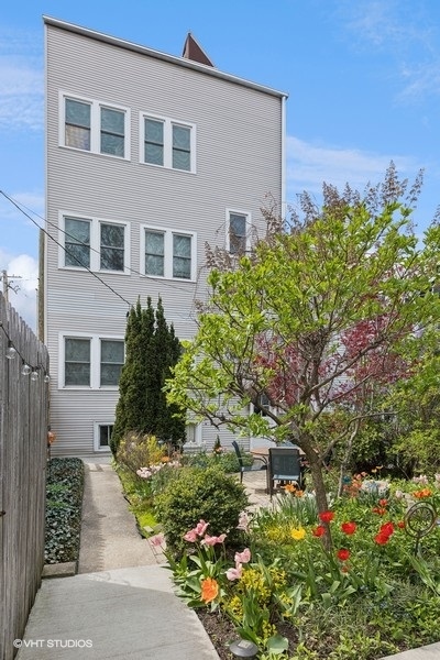 Undisclosed Address Chicago, IL 60657 - Photo 35 of 40 a pathway of a house with a yard