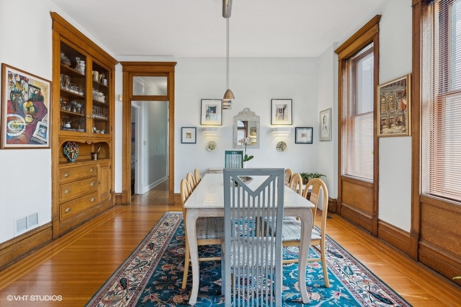Undisclosed Address Chicago, IL 60657 - Photo 4 of 40 a view of a dining room with furniture window and wooden floor