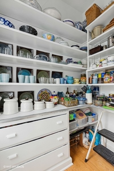 Undisclosed Address Chicago, IL 60657 - Photo 10 of 40 a room with storage and utility racks