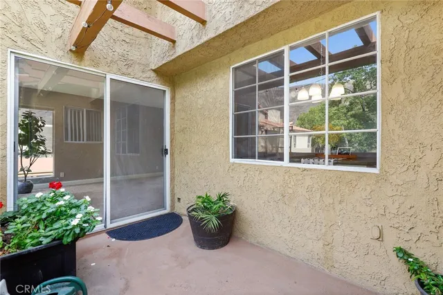 a view of a entryway with flower pots