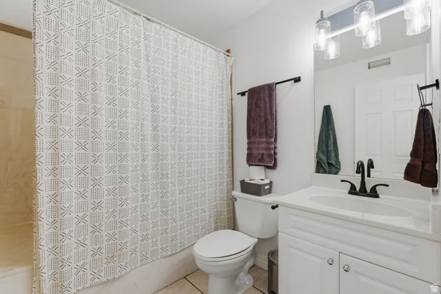 282 West 960 South, Unit C Provo, UT 84601 - Photo 16 of 33 Full bath with vanity, light tile patterned floors, and shower / bath combination with curtain
