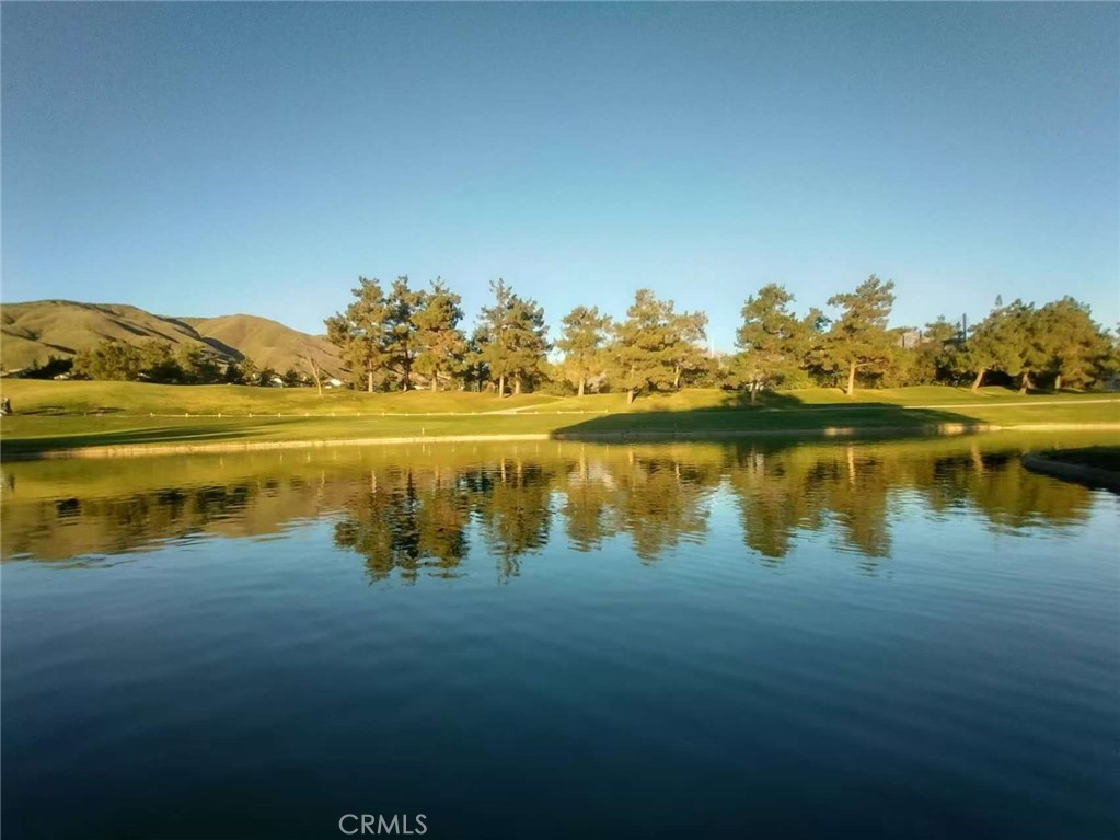 11811 Cramer Road Yucaipa, CA 92399 - Photo 22 of 22 a view of a lake with houses in the back