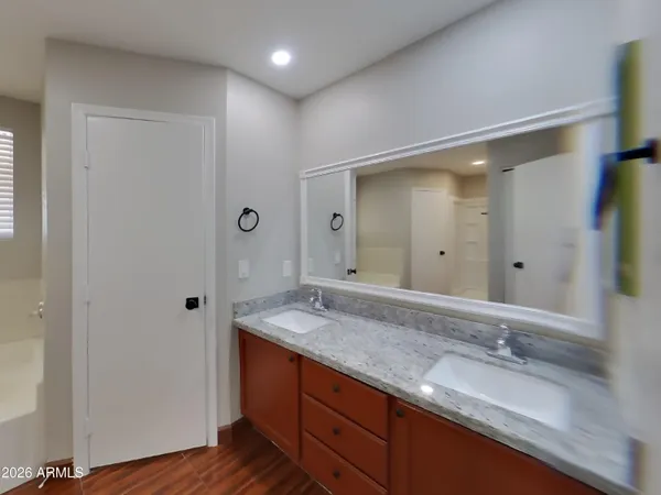 a bathroom with a bathtub and a sink