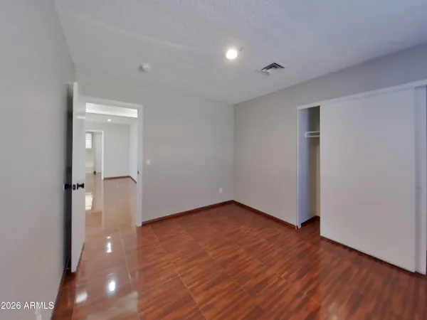 a view of hallway with wooden floor