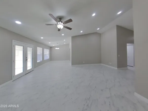 a view of an empty room with glass door