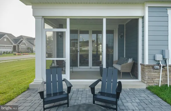 a view of a patio with two chairs and a table