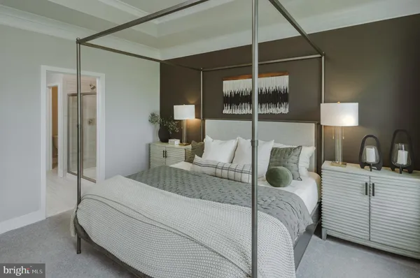 a bedroom with a bed and a mirror