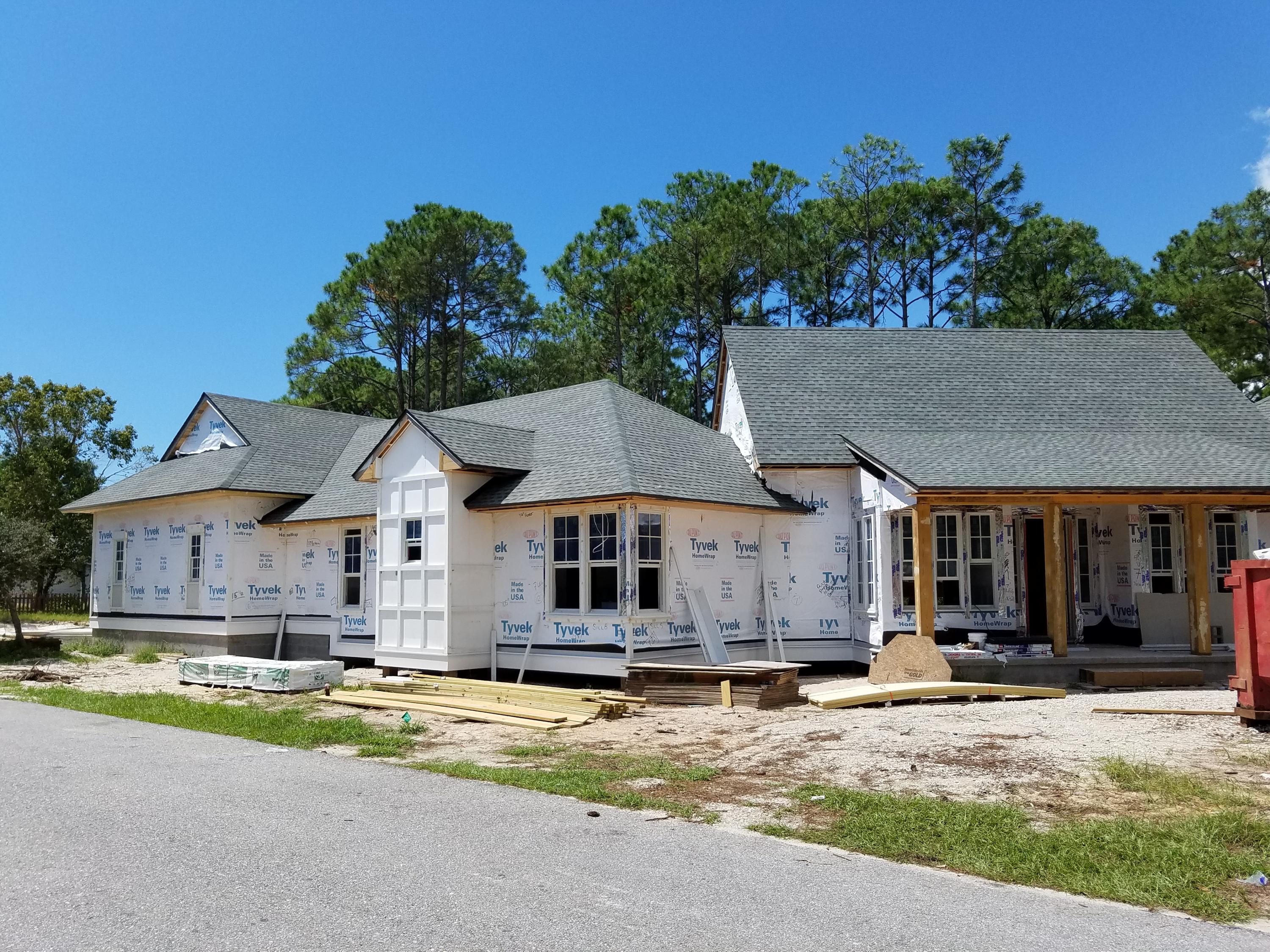 Lot 16 Ridge Road Santa Rosa Beach, FL 32459 - Photo 9 of 12 a view of a white house with a large pool in front of it