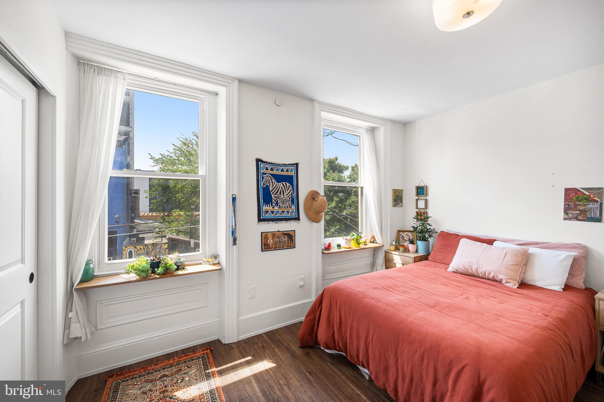 107 Master Street Philadelphia, PA 19122 - Photo 19 of 24 a bedroom with a bed and a window