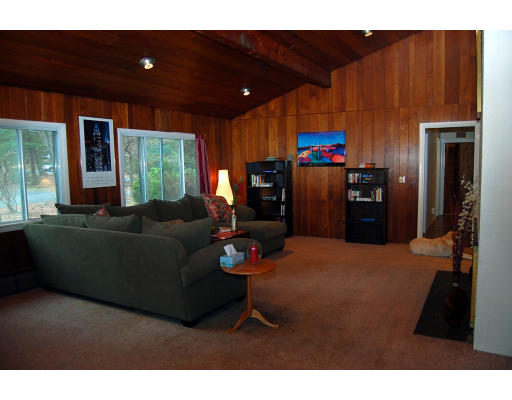 251 Highland Road Andover, MA 01810 - Photo 5 of 19 a living room with furniture and a flat screen tv