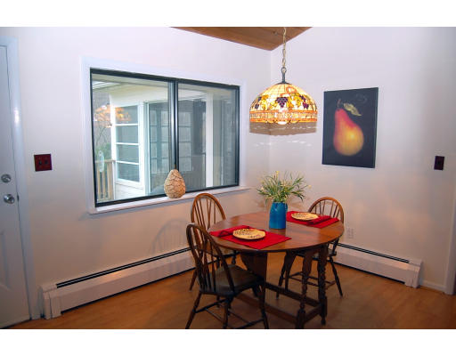 251 Highland Road Andover, MA 01810 - Photo 8 of 19 a view of a dining room with furniture and chandelier