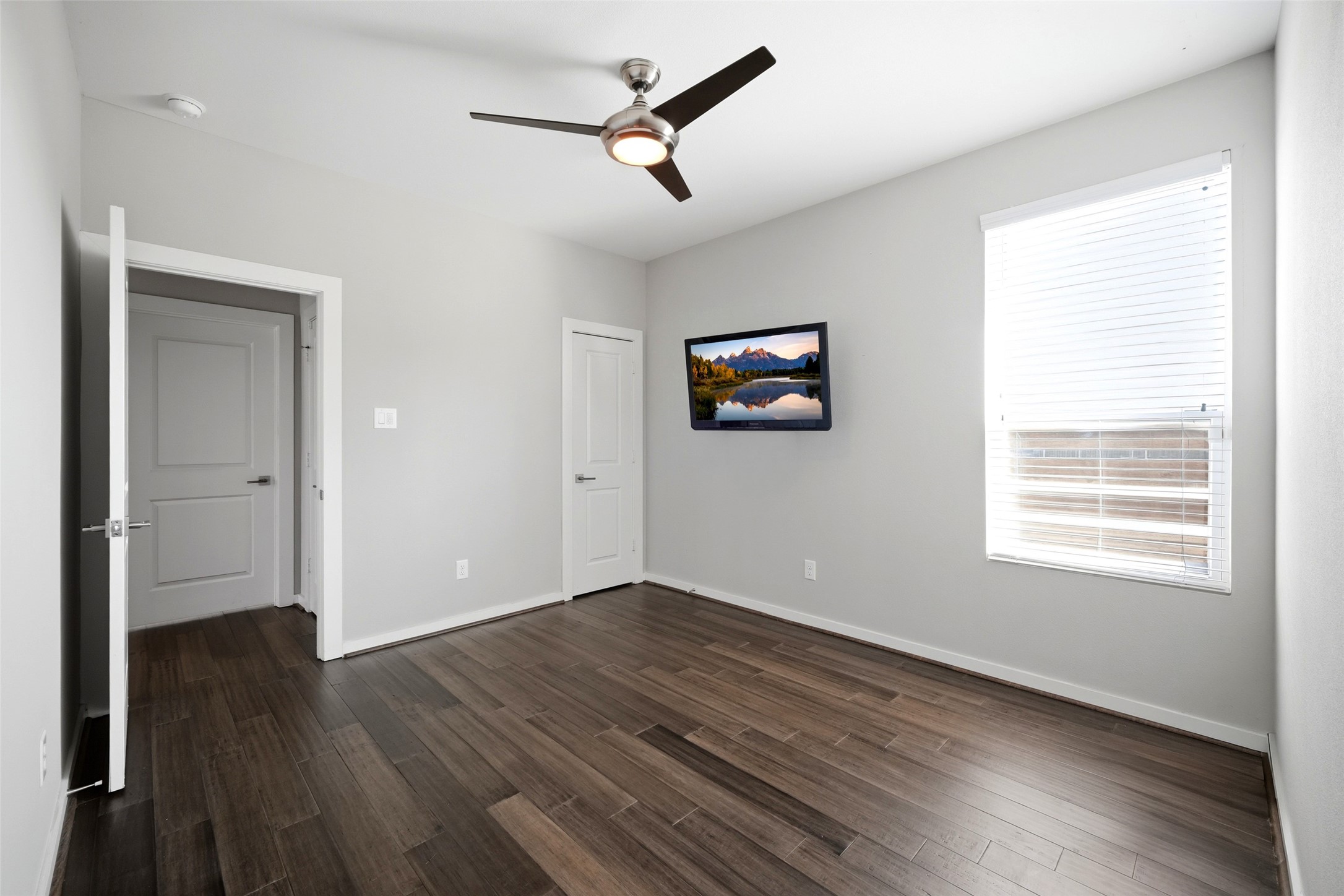 605 Dumble Street Houston, TX 77023 - Photo 36 of 44 a view of empty room with wooden floor and fan