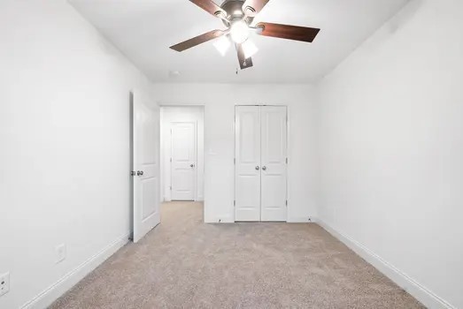 940 Britton Springs Road, Unit 203 Clarksville, TN 37042 - Photo 24 of 30 an empty room with closet and a chandelier fan