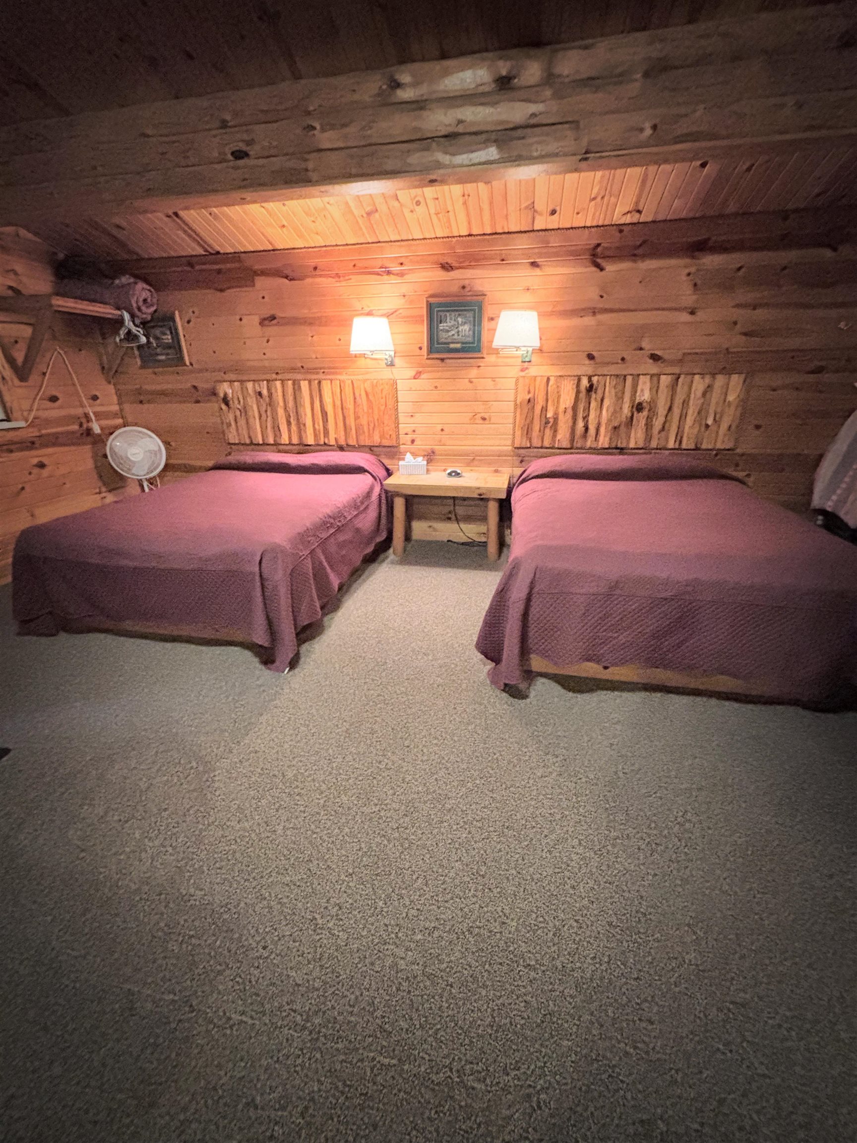 26420 Valhalla Lane Washburn, WI 54891 - Photo 5 of 9 Bedroom featuring a wooden ceiling with exposed beams, carpet floors, and wooden walls