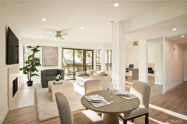 a view of a dining room with furniture window and wooden floor