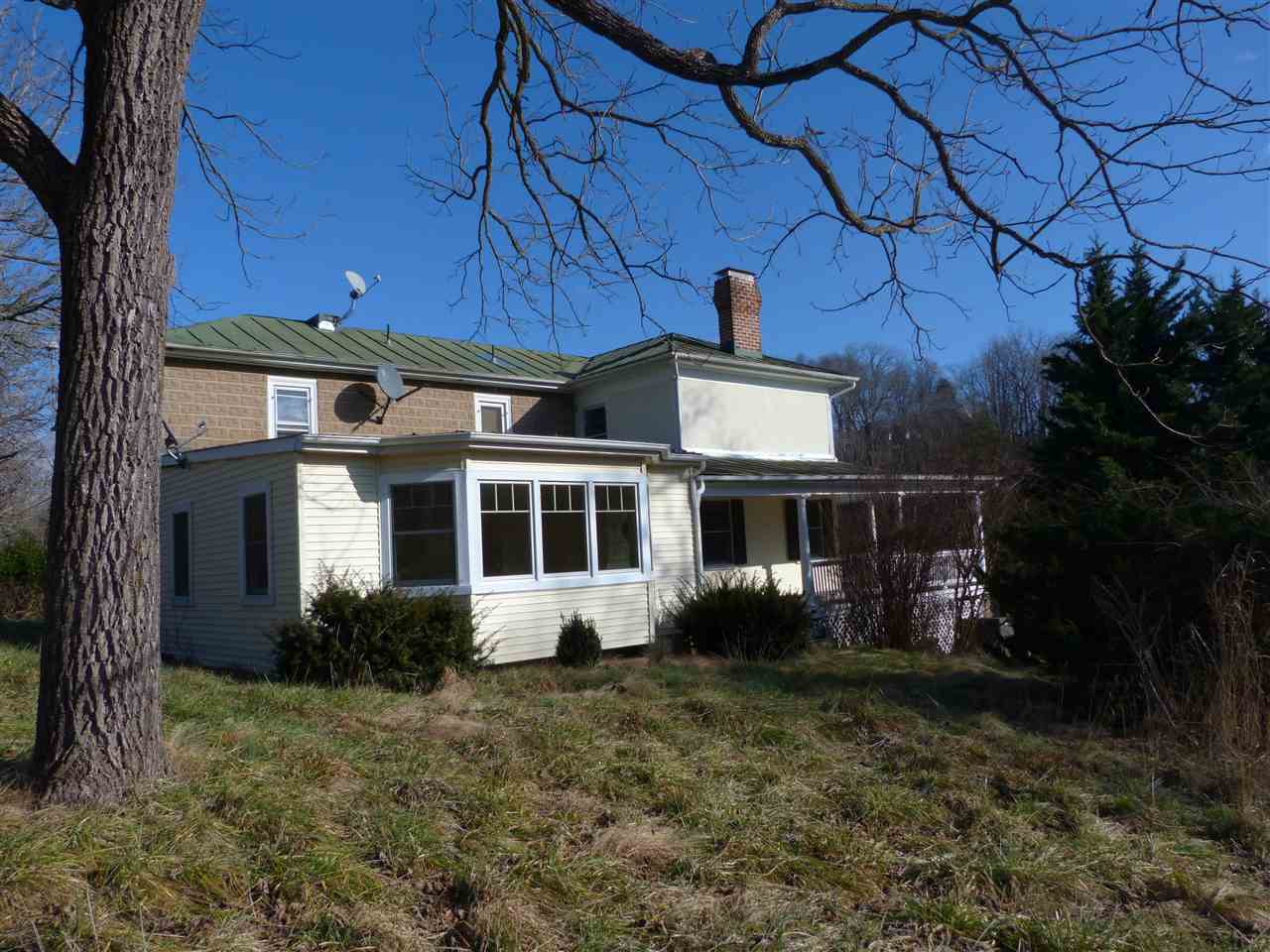 699 Roman Road Mount Sidney, VA 24467 - Photo 2 of 18 a front view of a house with garden