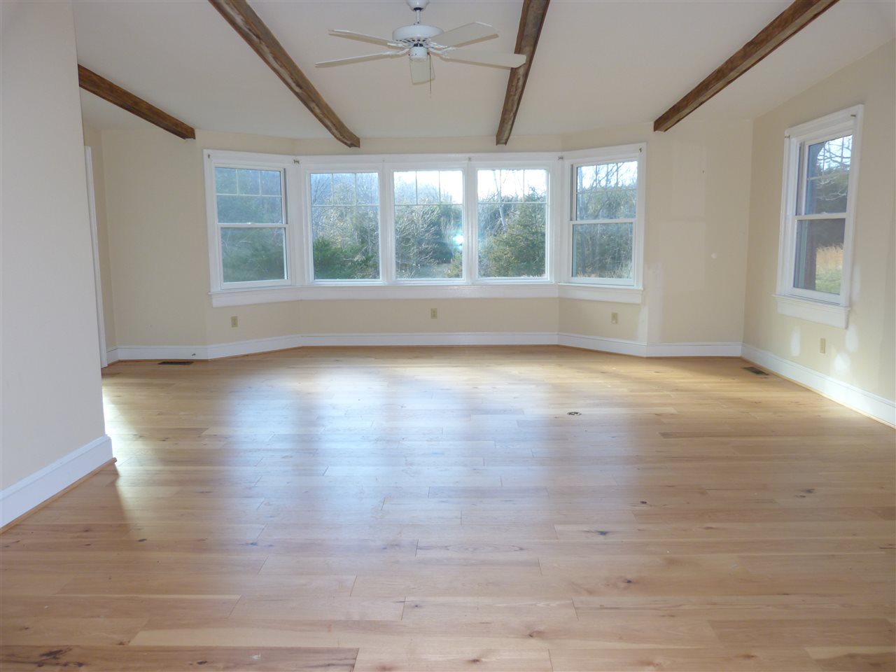 699 Roman Road Mount Sidney, VA 24467 - Photo 3 of 18 a view of empty room with wooden floor and fan