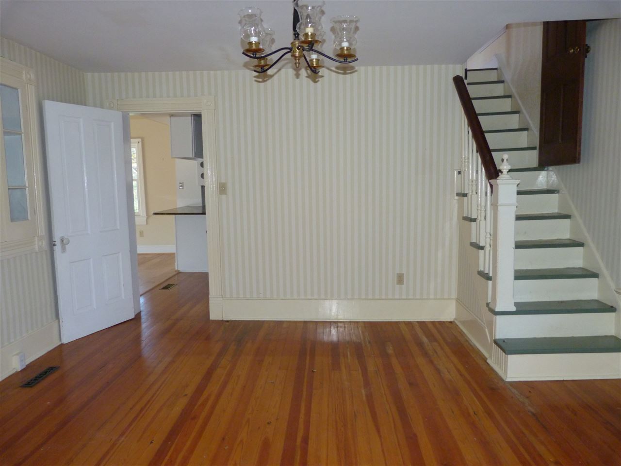 699 Roman Road Mount Sidney, VA 24467 - Photo 4 of 18 wooden floor in an empty room with a gallery