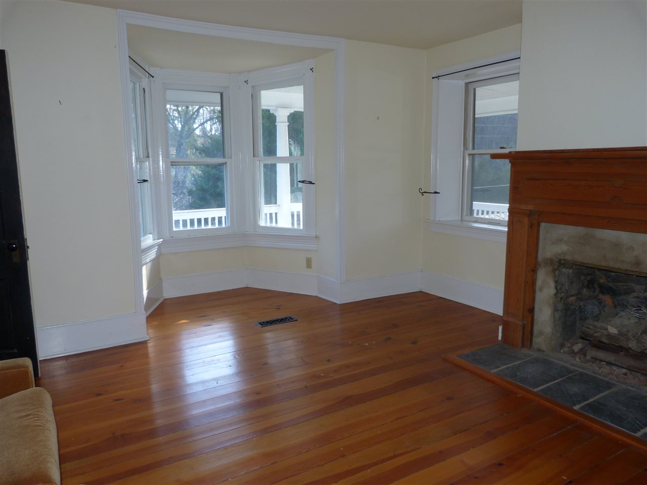 699 Roman Road Mount Sidney, VA 24467 - Photo 5 of 18 a view of empty room with wooden floor and fireplace