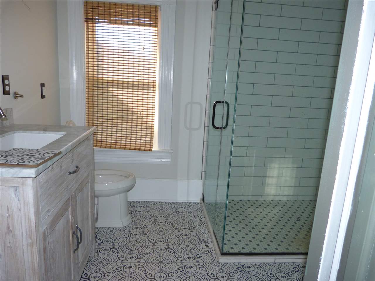 699 Roman Road Mount Sidney, VA 24467 - Photo 8 of 18 a bathroom with a granite countertop shower a toilet and a sink