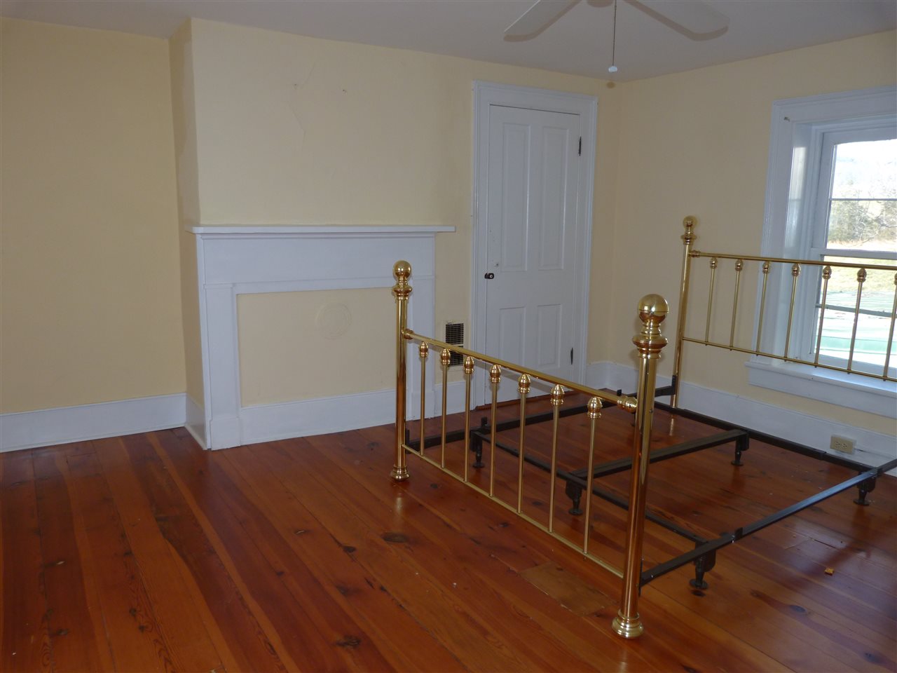 699 Roman Road Mount Sidney, VA 24467 - Photo 10 of 18 a view of a livingroom with wooden floor and a floor to ceiling window