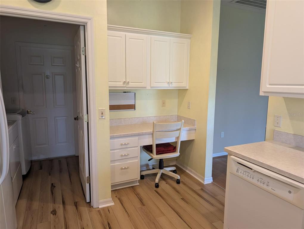 4124 Muirfield Loop Lake Wales, FL 33859 - Photo 16 of 29 a view of room with wooden floor and electronic appliances