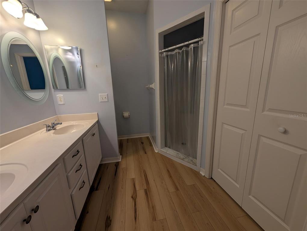 4124 Muirfield Loop Lake Wales, FL 33859 - Photo 20 of 29 a spacious bathroom with a double vanity sink and mirror