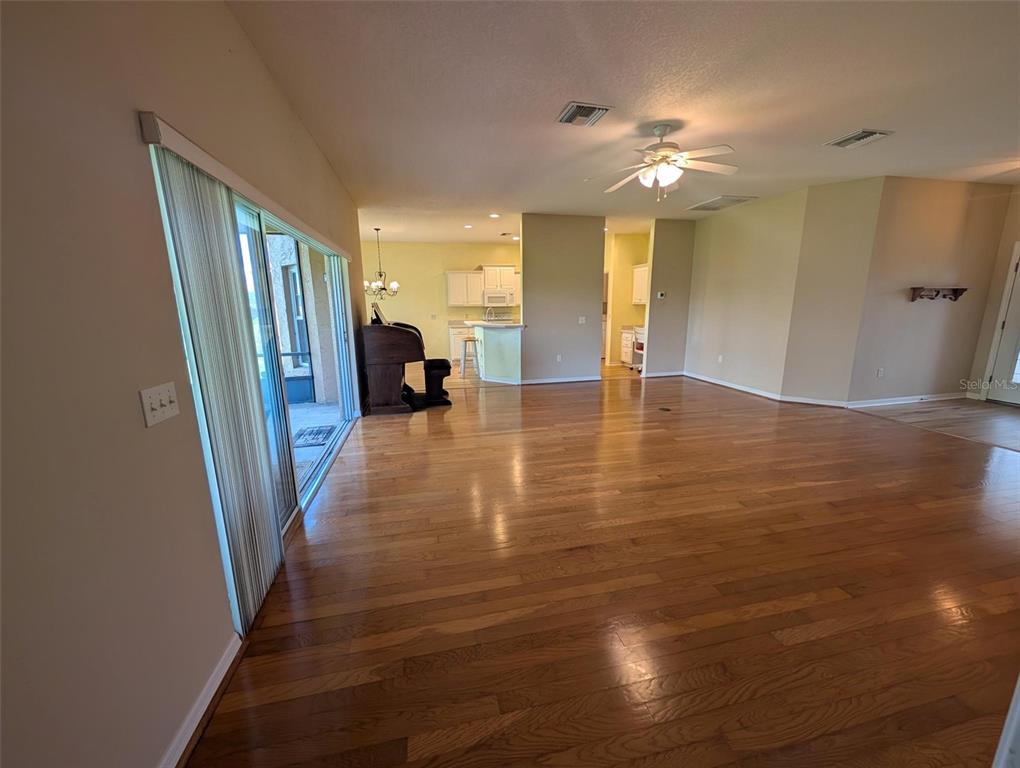 4124 Muirfield Loop Lake Wales, FL 33859 - Photo 6 of 29 a view of livingroom with hardwood floor and a ceiling fan