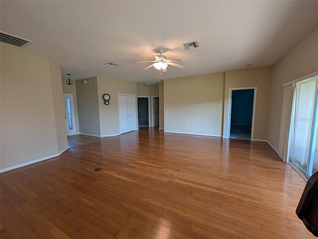 4124 Muirfield Loop Lake Wales, FL 33859 - Photo 7 of 29 a view of empty room with wooden floor