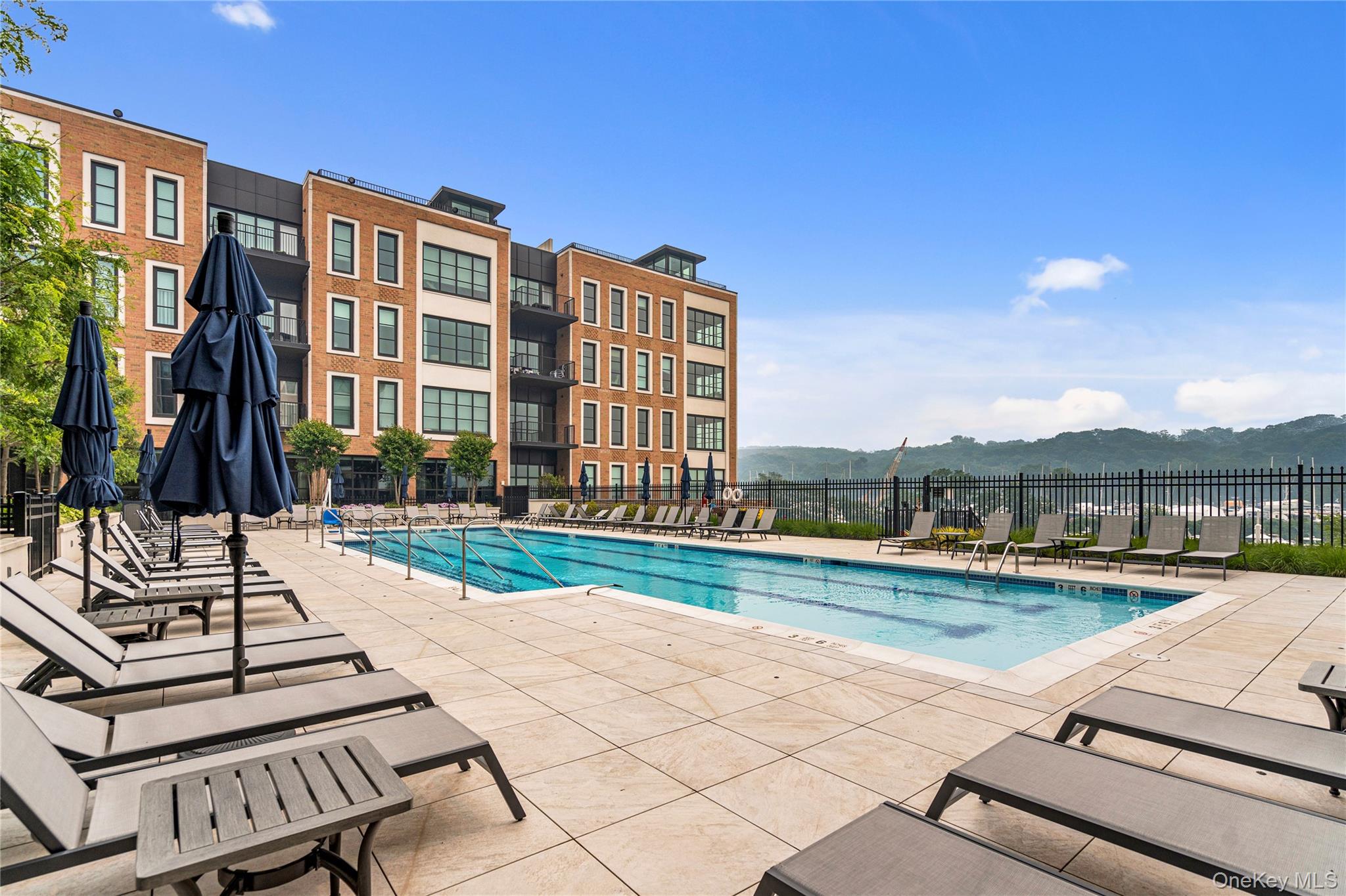 100 Garvies Point Road, Unit 1309 Glen Cove, NY 11542 - Photo 36 of 36 Community pool a patio