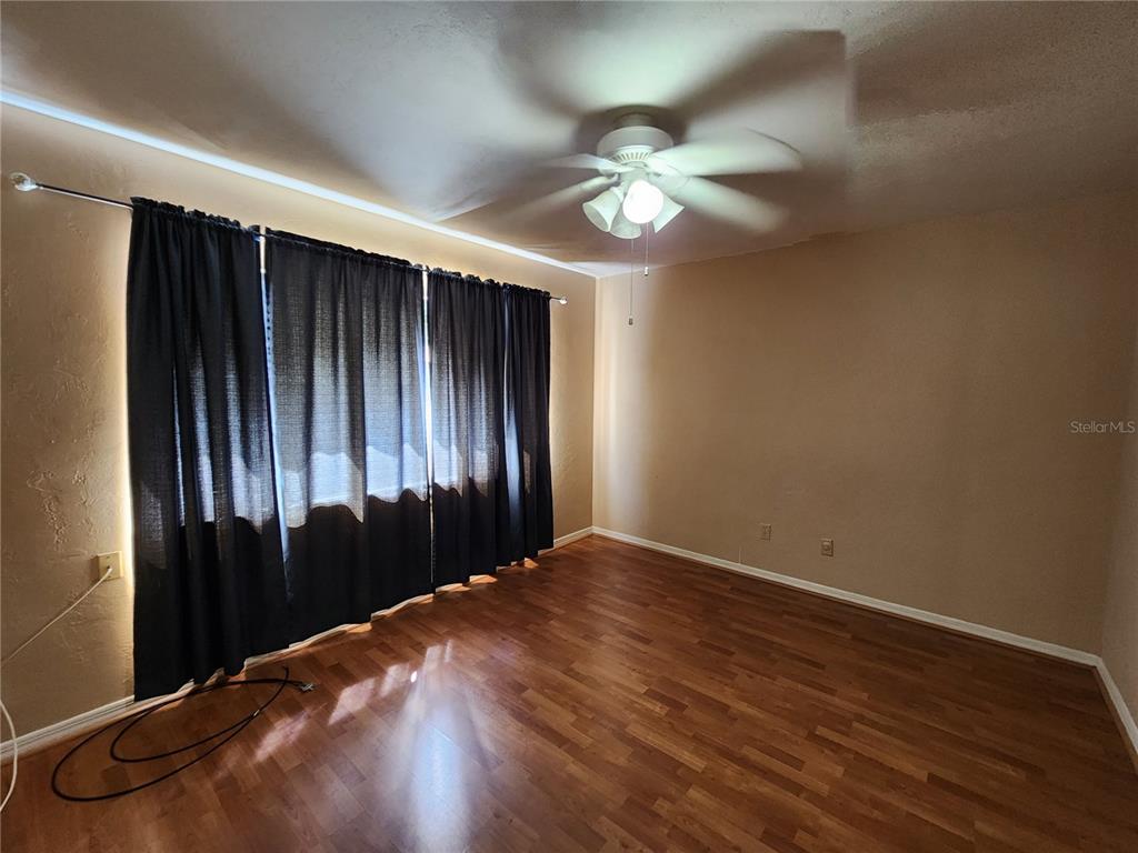 6288 Southwest 8th Place Gainesville, FL 32607 - Photo 12 of 21 wooden floor in an empty room