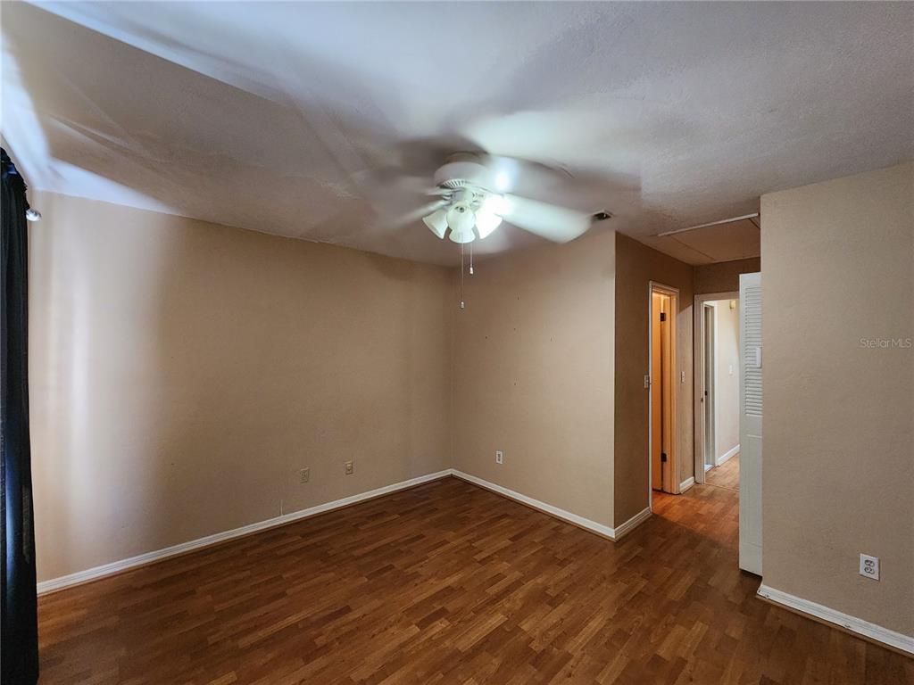 6288 Southwest 8th Place Gainesville, FL 32607 - Photo 14 of 21 wooden floor in an empty room