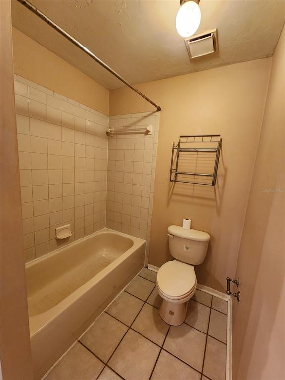 6288 Southwest 8th Place Gainesville, FL 32607 - Photo 18 of 21 a bathroom with a toilet and a shower