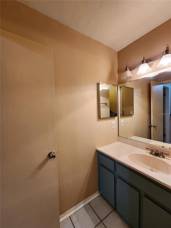 6288 Southwest 8th Place Gainesville, FL 32607 - Photo 19 of 21 a bathroom with a sink and a mirror