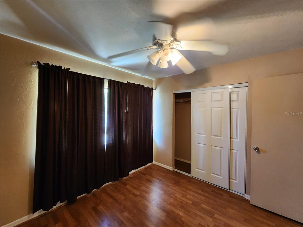 6288 Southwest 8th Place Gainesville, FL 32607 - Photo 10 of 21 wooden floor in an empty room