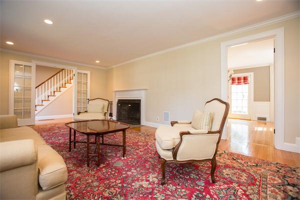 25 Oxbow Road Wellesley, MA 02481 - Photo 3 of 14 a living room with furniture a fireplace and a table
